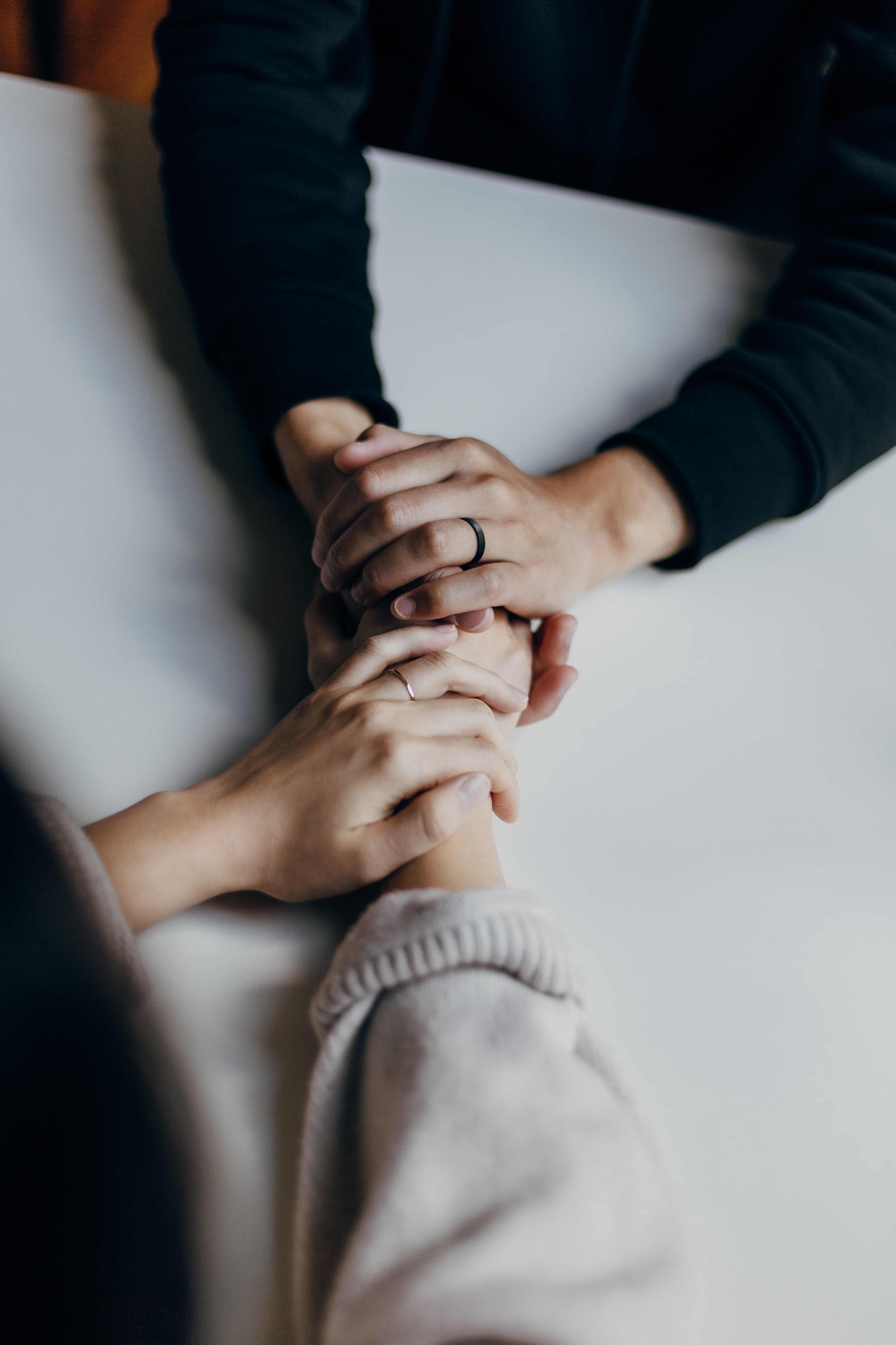 Therapist holding clients hands